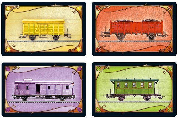 Cards from the Ticket To Ride board game that show a yellow boxcar, a red coal car, a pink caboose and a green passenger car.